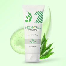 Neem Tulsi face wash tube with green leaves on a light green background