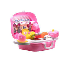 Pink toy kitchen set with various utensils on a white background