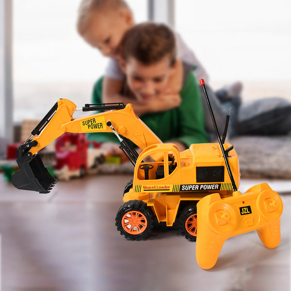 Toy excavator with remote control in front of a child playing with toys in the background