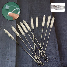 Set of straw cleaning brushes on a dark textured surface with close-up inset showing usage.