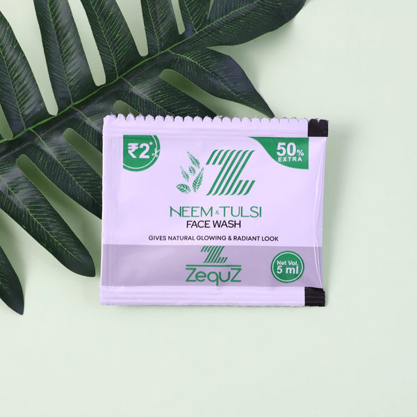 Zequz Neem Tulsi face wash packet with green leaves on a light green background