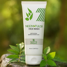 Neem Tulsi face wash tube with green leaves on a natural background