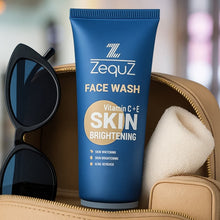 Zequz face wash tube with sunglasses and towel on a blurred background