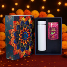 Gift set with a colorful mandala design box, white thermos, and pink packet on a dark background.