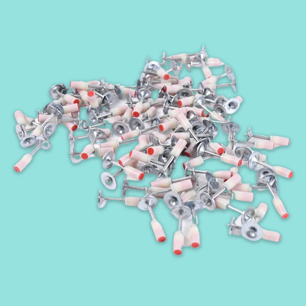 Collection of medical or dental instruments on a light blue background