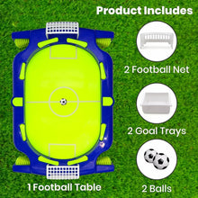 Football table with accessories on a grass background