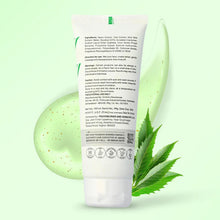 Green skincare product with a leaf on a light green background