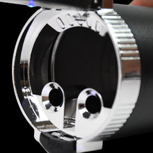Close-up of a chrome car exhaust tip with 'Vossen' branding.