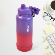 Gradient purple to red water bottle with 'HOLO' branding on a white surface with office items.