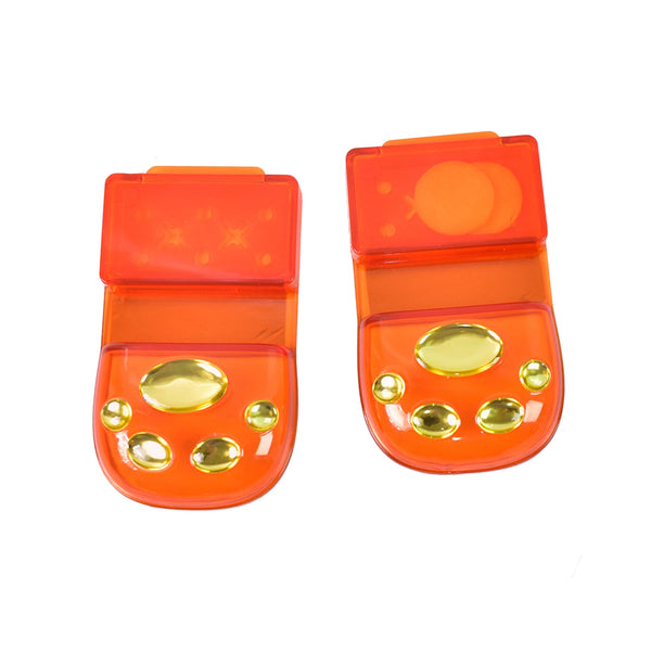 Two orange reflectors with gold accents on a white background