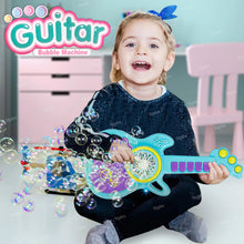 Child playing with a toy guitar bubble machine surrounded by bubbles.
