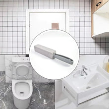 Cleaning brush with a close-up inset in a bathroom setting.