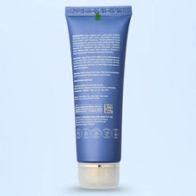 Blue skincare product tube with text on a light blue background