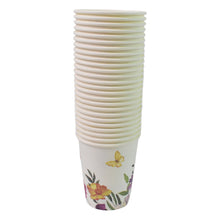 Stack of paper cups with floral design on a white background