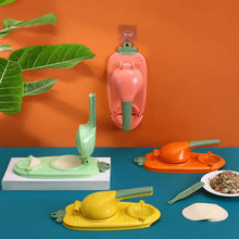 Set of colorful kitchen tools shaped like vegetables on a blue surface with an orange wall background.