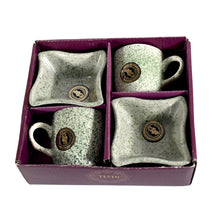 Set of ceramic mugs and trays with a logo in a purple box