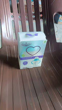 Box of baby products on a wooden surface