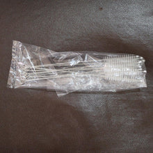 Packaged straw on a dark textured surface