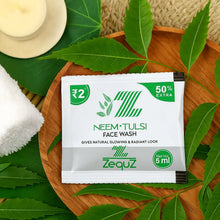 Zequz Neem Tulsi Face Wash packet on a wooden tray with leaves and a candle.