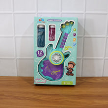 Toy guitar packaging with bubble machine on a wooden surface and tiled wall background