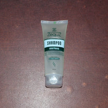 Zequz shampoo bottle on a brown surface