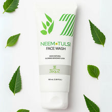 Neem Tulsi face wash tube with green leaves on a white background
