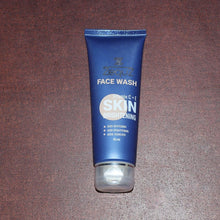 Blue face wash tube on a brown surface