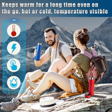 Two people sitting on a rock with backpacks, one holding a blue thermos, mountainous background.