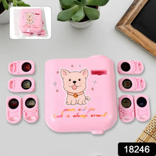Pink pet training device set with cartoon dog design on a light gray surface.