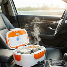 Portable heating lunch box with steam inside a car