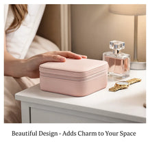 Pink jewelry box on a table with a bottle of perfume and a watch, text 'Beautiful Design - Adds Charm to Your Space'.