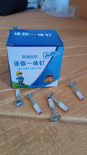Box of mini nail with nails on a textured surface