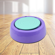 Purple and green exercise step platform on a wooden floor