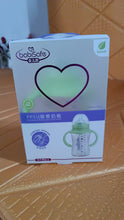Babysafe bottle packaging on a wooden surface