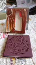Oreo cookie packaging with branding on a patterned surface