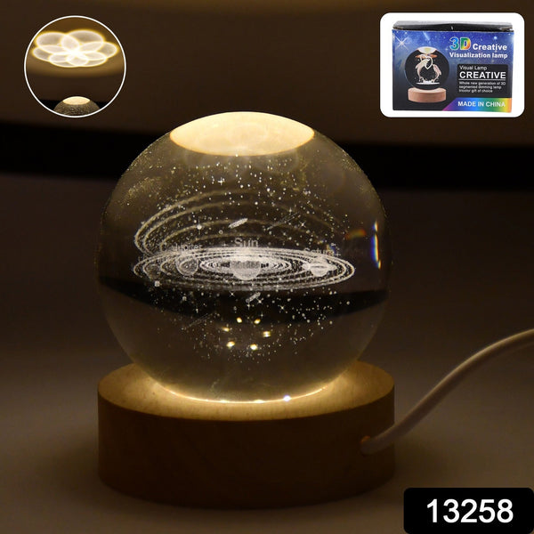 Glass ball with marble design on a wooden base, illuminated from within.