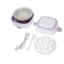 Electric rice cooker with accessories on a white background