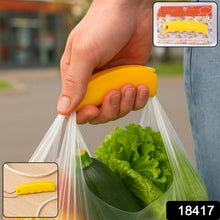 Hand using a yellow plastic bag sealer to close a bag with vegetables outdoors.