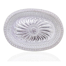 Oval silver serving tray with royal design for upscale presentation.