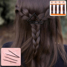 Hair braid with a hairpin and additional hairpins displayed.
