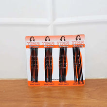 Pack of black hair extensions on a white background