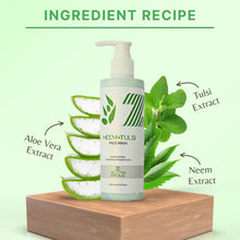 Neem Tulsi face wash bottle with aloe vera and tulsi leaves on a light green background