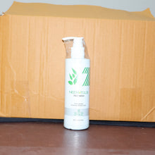 Neen Naturals face wash bottle in front of a cardboard box