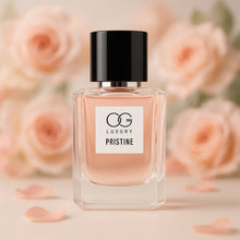 Perfume bottle labeled 'OG Luxury Pristine' with pink roses in the background