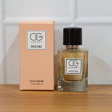 OG Luxury Pristine eau de parfum bottle and packaging on a wooden surface with a white background