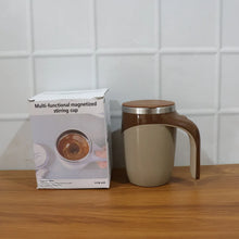 Multi-functional magnetized stirring cup with packaging on a wooden surface.
