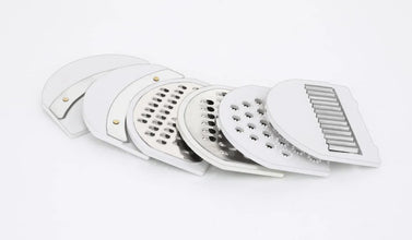 Versatile vegetable cutter and slicer with drain basket.