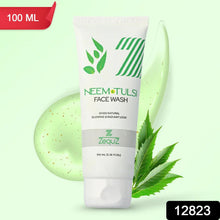 Neem Tulsii Face Wash tube with green leaves and aloe vera on a light green background