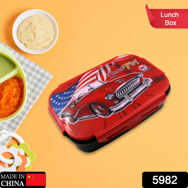 Red car-themed lunch box with food items on a yellow background