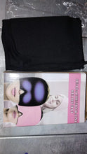 Black headband and packaging with a woman's face on a gray surface